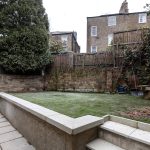 NW1 house extension garden stone paving raised lawn Camden London